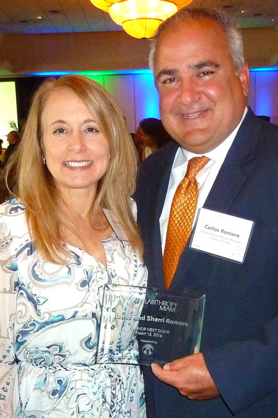 Carlos and Sherri Romero, Carlos is a board member, receive award.